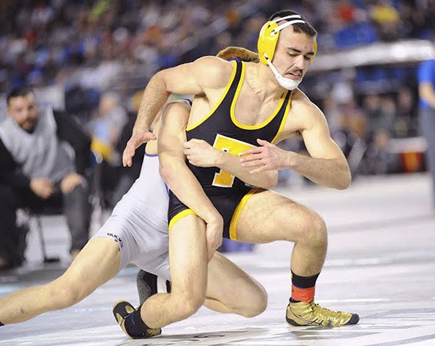 Tahoma senior Cruz Velasquez tries to escape in the 126-pound  finals  match up  on Feb. 22 in the Tacoma Dome.