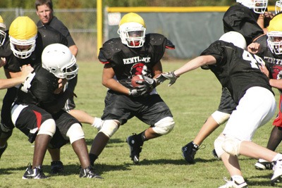 Kentlake High football practice in full swing Monday.