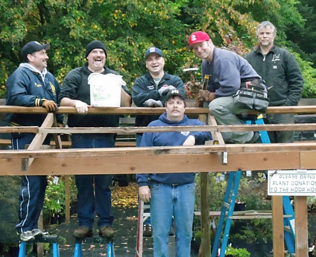 Maple Valley Fire and Life Safety firefighters volunteer their time during Make A Difference Day at the Lake Wilderness Arboretum.