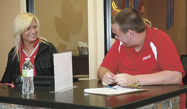 Skyler Daniels laughs along with co-worker Miranda Hallock at  Maple Valley Fitness