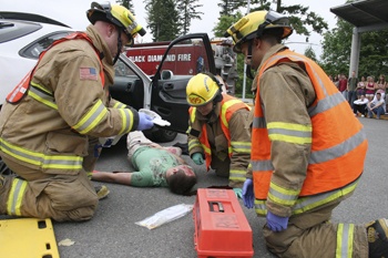 Kentlake student Nick Swaner played the part of an injured victim Friday in a simulated DUI crash scene at the high school.