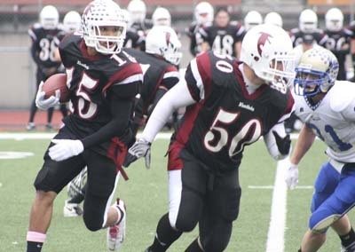 Kentlake's Tyler Wright looks for daylight Saturday at French Field. The Falcons beat Tahoma 21-6.