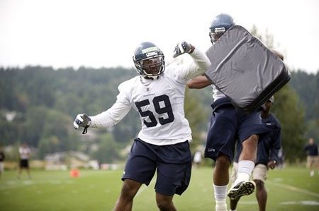 Seahawks linebacker Aaron Curry works out during training camp