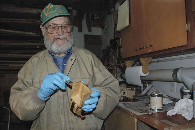 Vern Heinle works on a toy inside of his workshop. This Christmas season