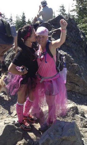 Tami Kapule and her daughter celebrate defeating breast cancer atop Mt. Si last weekend.