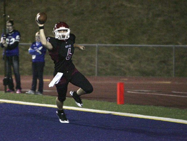 Kentlake's Steffin Church keeps the ball and runs in a touchdown