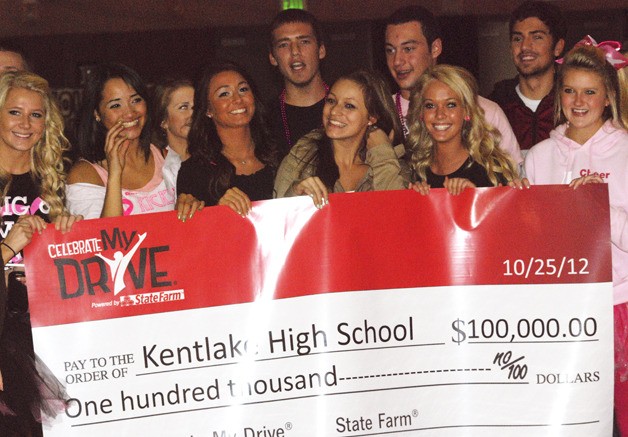 Kentlake students hold up a check from StateFarm for $100