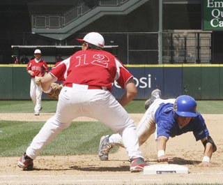 Tahoma's Taylor Smart slides back to first safely on a pick-off play Saturday at Safeco Field during the state tournament.