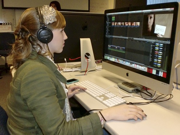 Aili Carmichael works on a film in Rick Haag’s video production class. The film academy will integrate it with English