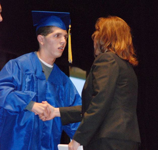 Tahoma High graduate Zackery Lystedt receives his dipolma from Didem Pierson