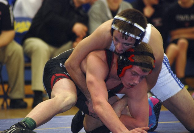 Tahoma’s Joey Palmer works to gain a better position against Kentlake’s Colton Marlowe in the 138 pound match during a double dual meet. Kentlake and Kent-Meridian traveled to Tahoma for the double dual on Jan. 4. Tahoma won both of its duals while Kentlake beat Kent-Meridian.