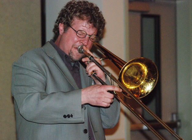 Tom Garling plays trombone during the Carly Stowell Foundation wine and jazz fundraiser May 13 at St. John the Baptist Cathoilic Church in Covington.