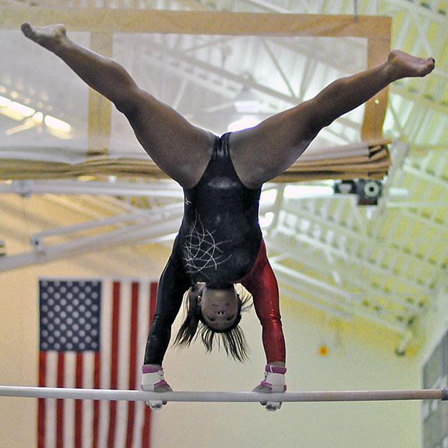 Kentlake’s Ashley Pernell performs on the bars during a meet with Auburn Mountainview earlier this month. Pernell returned to the Falcons team which has two new co-coaches this year.