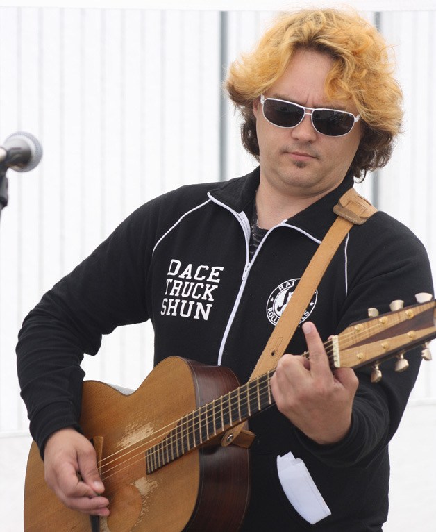 Dace Anderson with the band Sealth performed at the Maple Valley Farmers Market Saturday.