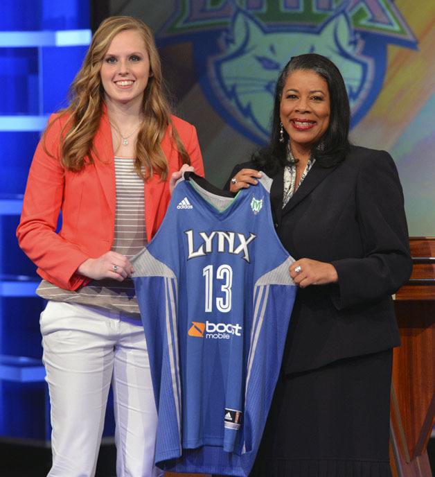 Moore with WNBA president Laurel J. Richie at the draft April 15. Moore was the 12th pick.