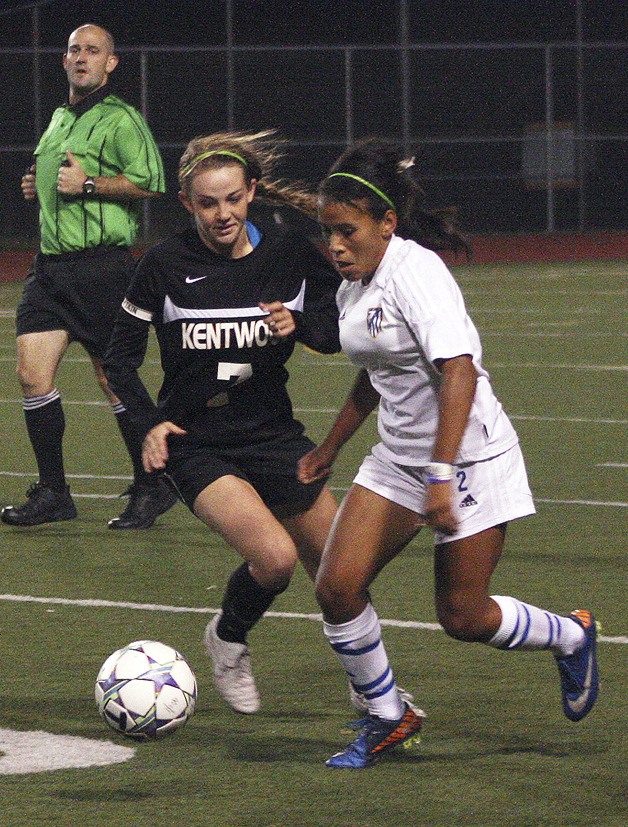 Kentwood’s Sarah Bindl battles with Tahoma’s Brie Hooks for the ball during the game which the Conks won 2-1 on Oct. 1 at Maxwell Stadium.