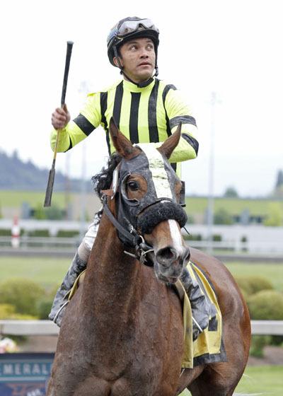 Mike and Amy Feuerborns homebred 3-year-old filly Class Included and jockey Leslie Mawing en route to the winner's circle after the $50