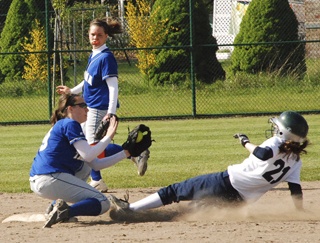 Tahoma second baseman Hayley Beckstrom tries to tag out a Beamer player during an SPSL playoff game last Friday.