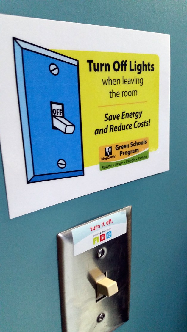 Tahoma’s Green Teams encourage reducing energy costs by reminding people to shut off the lights with these signs.