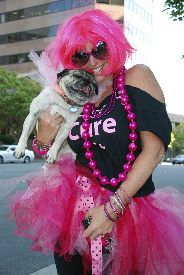 Laura Bingle of Maple Valley stops for a photo Friday during the Susan G. Komen 3 Day Walk For the Cure in Bellevue. Bingle is a member of the 160-strong Valley Girls & Guys team which was started by Ravensdale resident Tina McDonough.