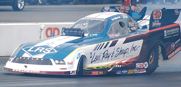 Tim Wilkerson completes a burn out in his funny car during the second round of qualifying at the NHRA’s 24th Annual O’Reilly Auto Parts Northwest Nationals at Pacific Raceways. Wilkerson beat Jack Beckman in the final Sunday.