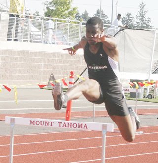 Steven Warner running the 300-meter hurdles Saturday at Mount Tahoma in the district 4A meet. Warner qualified for state in the 110-meter hurdles