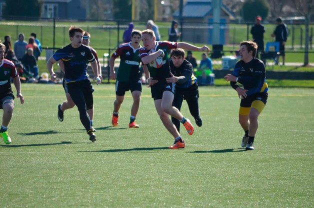 Nathan McCain (center) runs down field during the Prezfest 2015 tournament.