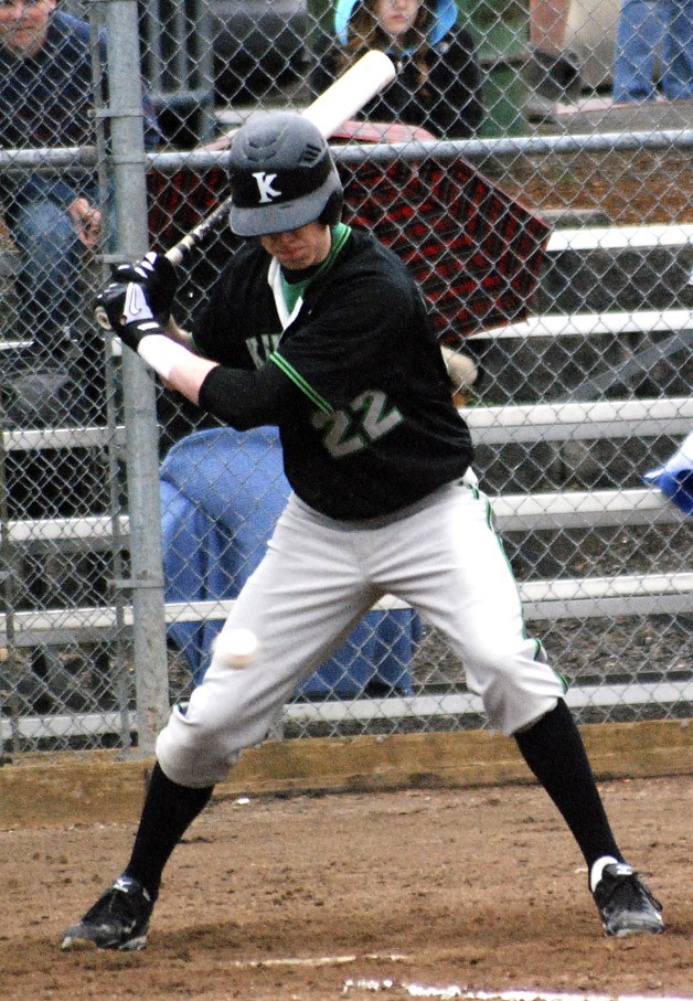 Kentwood’s Tanner Wessling waits for the right pitch and watches the ball go by in a game Tuesday against Auburn Riverside.