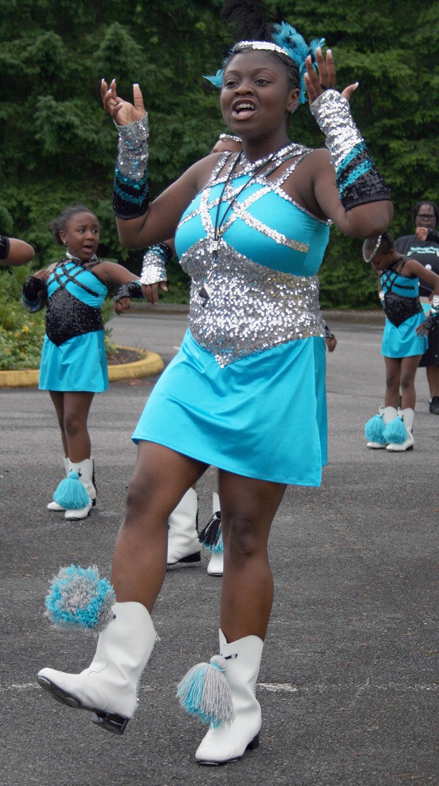 Elexis Dixon practices with the Essential Steppers and Drum Squad prior to the start of the Covington Days Parade July 21. Dixon will be a senior at Kentlake High in the fall.