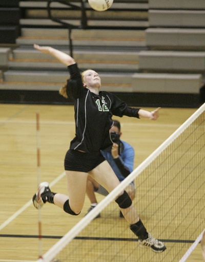 Kentwood outside hitter Erin Campbell spikes the ball for a kill during last weekend’s league tournament.