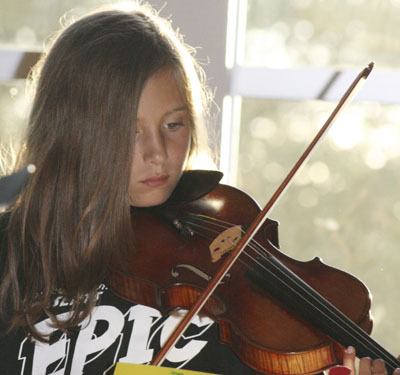 Alexa DeMarco plays violin during the maple Valley Youth Symphony Orchestra Summer Music Camp Concert Aug. 20 at Shepherd of the Valley Lutheran Church.