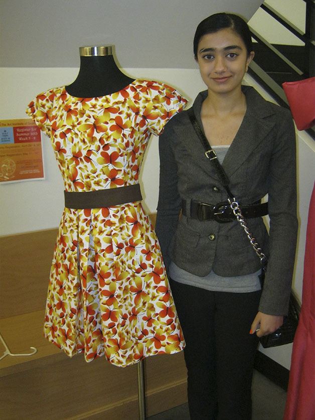 Kentwood student Harleen Kaur poses with her winning dress.