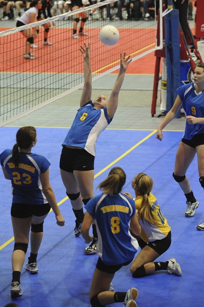 Tahoma senior Megan Brothers sets up teammate Morgan Murrey (9) during state tournament play.