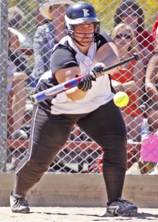 Kentwood's Kayla Evans lays down a bunt during the 4A state fastpitch tournament last week.