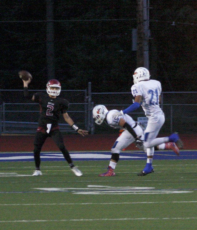 Kentlake senior quarterback Cody Faulkner looks for an open receiver during Friday’s game against Graham Kapowsin at French Field.