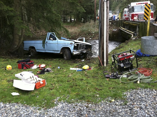 A man rolled his pickup into Covington Creek March 14 and was rescued by five men.