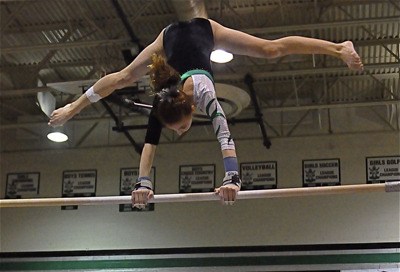 Kentwood’s Jordan Johnson will compete on the bars at the district championship meet this weekend on the vault