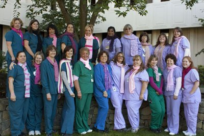 The Breast Center staff showcases a few of the donated handmade scarves.  Top from left: Patricia Marcella