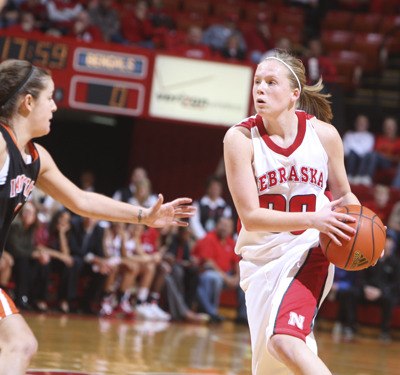 Kentwood graduate Lindsey Moore keeps the ball away from a defender during a Nebraska home game earlier this season. Moore is starting as a freshman.