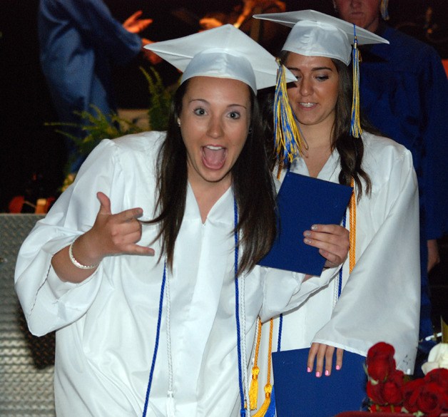 Hayley Beckstrom celebrates after walking across the stage during Tahoma High's graduation ceremony Tuesday night at White River Amphitheatre.