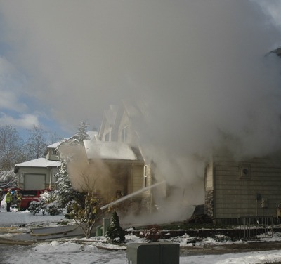 Maple Valley Fire and Life Safety firefighters battle this blaze Tuesday