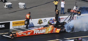 Top Fuel driver Cory McClenathan does a burnout during the first round of qualifying on July 9 at Pacific Raceways. McClenathan won the event.