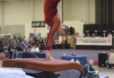 Kent-Meridian's Nora Keith medals in the vault at the state gymnastics tournament.