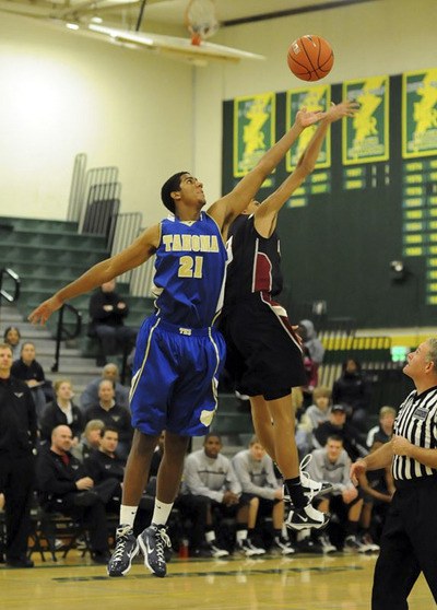 Tahoma senior Christian Behrens jumps for the ball in a jamboree game on Nov. 27. He is one of seven seniors returning for the Bears.