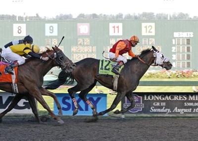 Gallyn Mitchell riding Assessment won the 74th running of the Longacres Mile Aug. 20