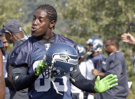 Seahawks wide receiver Deion Branch has fun on the sidelines at a training camp practice Monday morning at the Virginia Mason Athletic Center in Renton. The practice was the first- ever training camp session open to fans at the  VMAC.