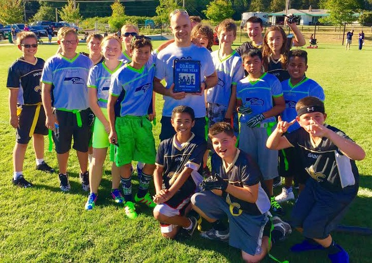 Jason Morrison was honored as Coach of the Year at a flag football game. Courtesy photo