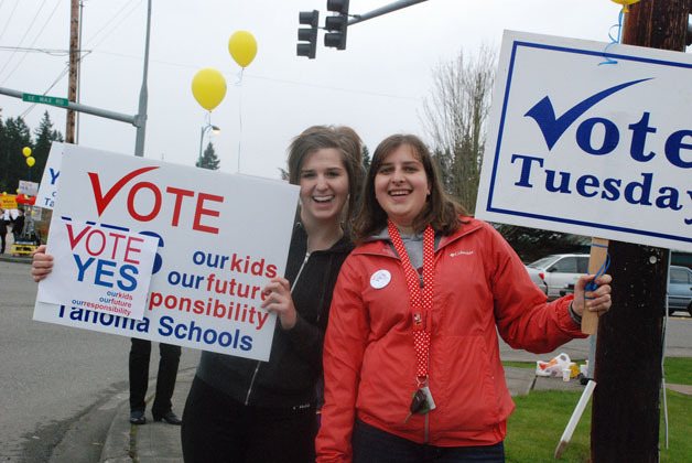 Supporters of the Tahoma School District construction bond waved signed in Maple Valley at the intersection of S.E. Wax Road and state Route 169.