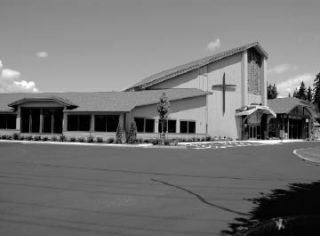 The old entry of Kent Covenant Church is flanked by a new office wing on the left and