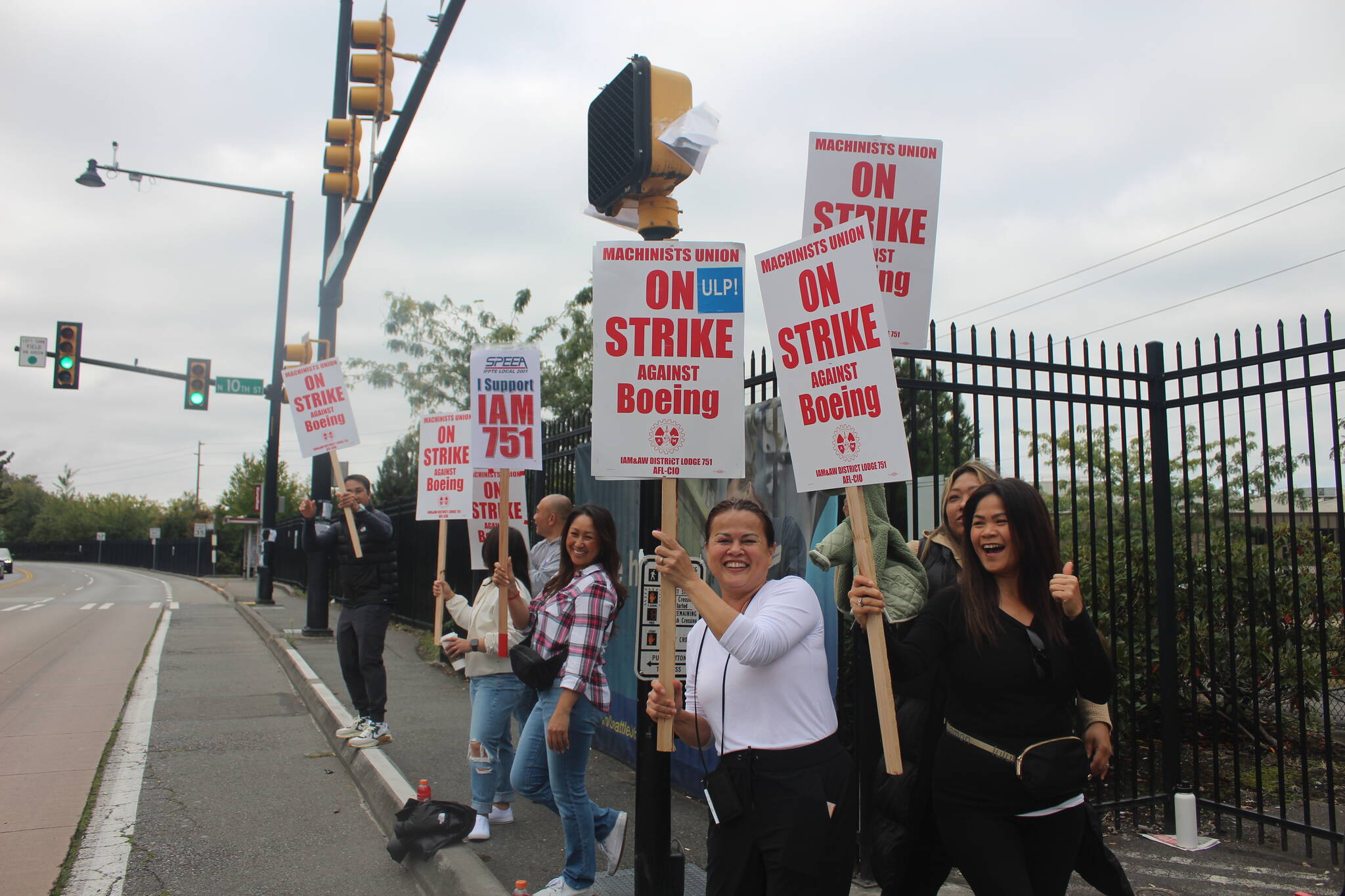 Workers stand outside of the Renton Boeing plant on the first day of the strike. Photo by Bailey Jo Josie/Sound Publishing.